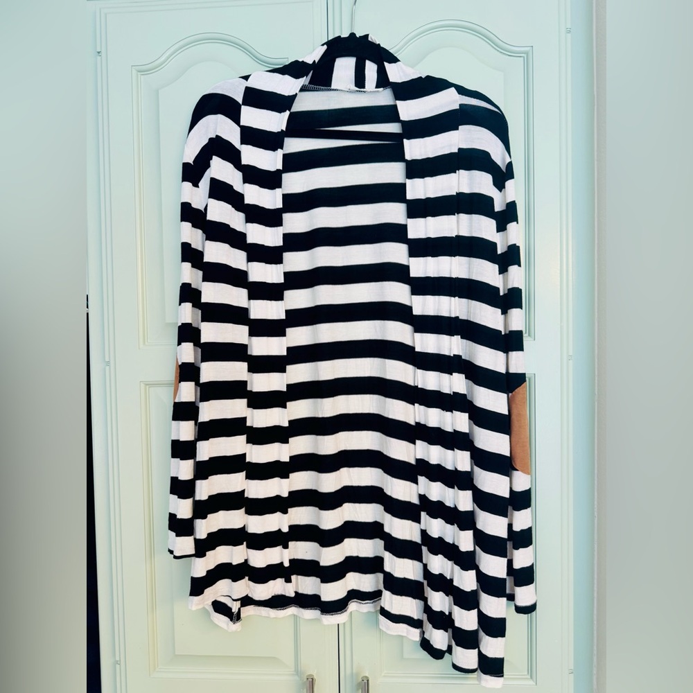 Reborn Black and White Striped Cardigan with brown suede elbow pads.